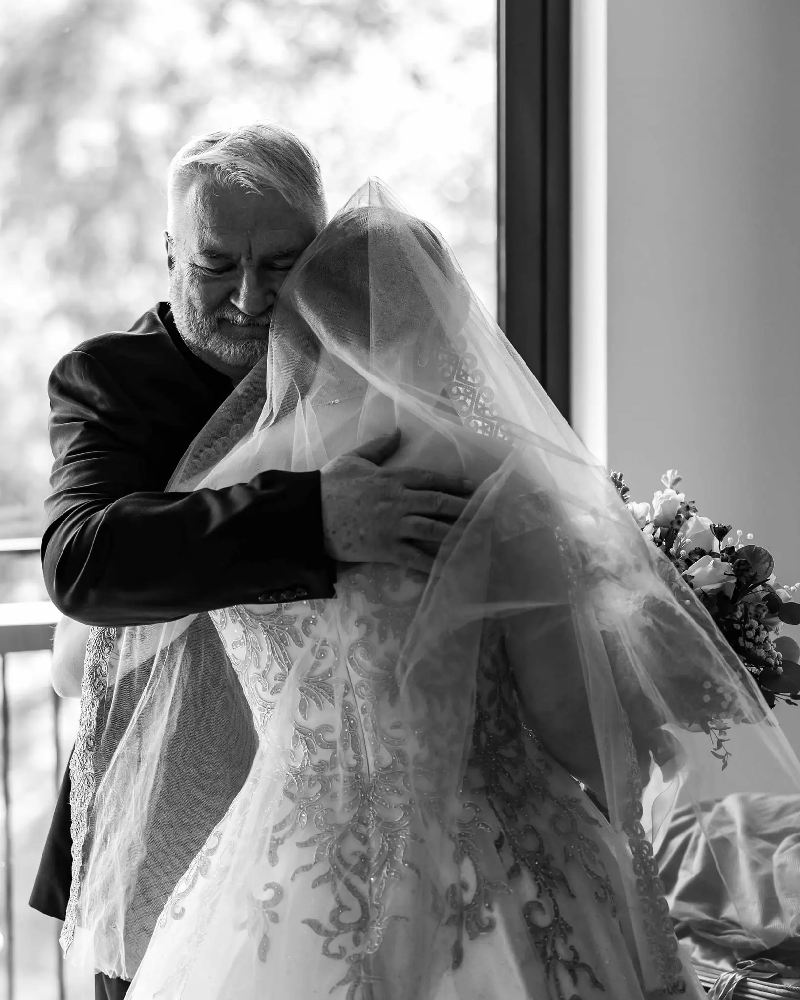 Jessica and Hayden wedding at Grand Bohemian Lodge Greenville, SC — the bride and her father embracing, black and white
