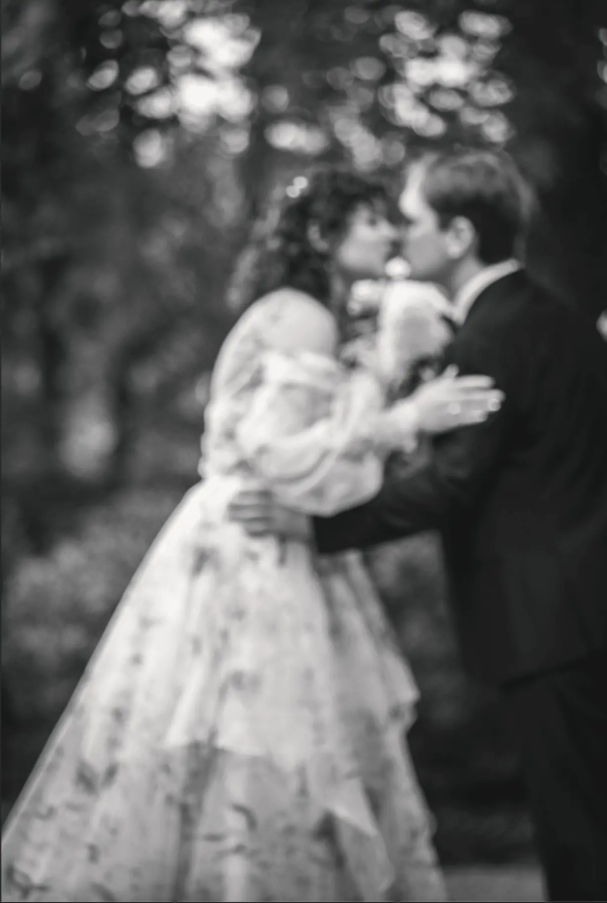 Jeff and Maya in a black and white dip kiss at Weaver House, Asheville